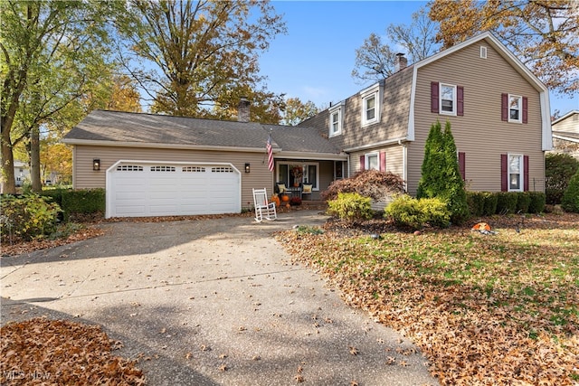 front of property with a garage