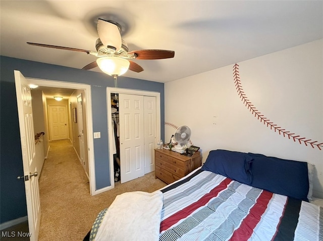 carpeted bedroom with a closet and ceiling fan