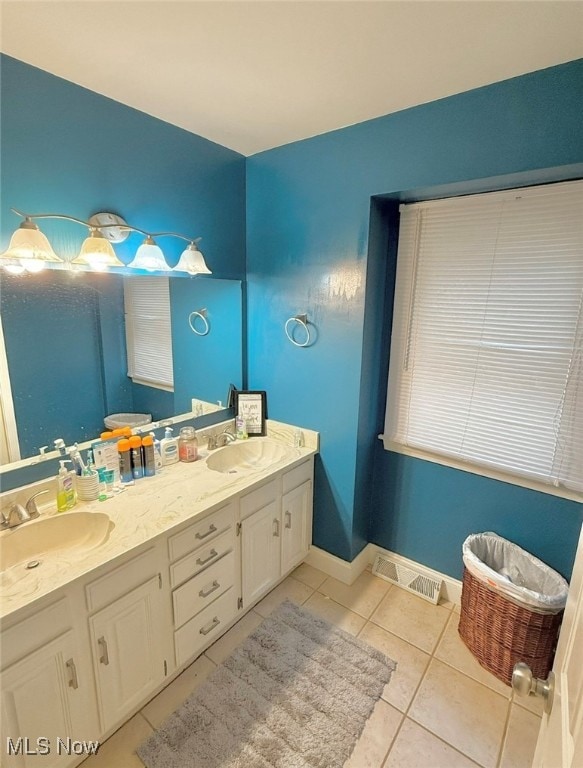 bathroom with vanity and tile patterned flooring