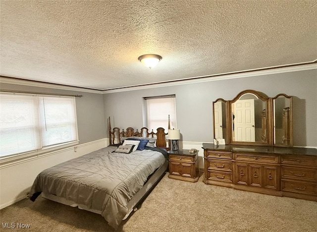 bedroom featuring crown molding, a textured ceiling, and light colored carpet