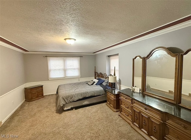 carpeted bedroom with a textured ceiling and ornamental molding