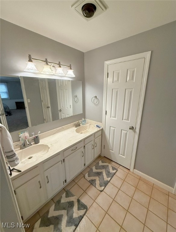 bathroom with vanity and tile patterned floors