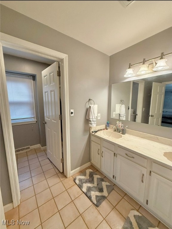 bathroom featuring vanity and tile patterned flooring