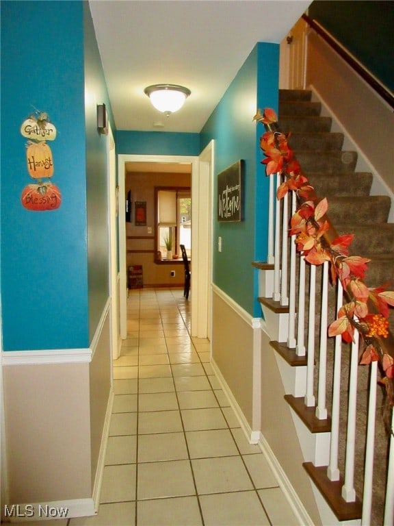 hall featuring tile patterned flooring