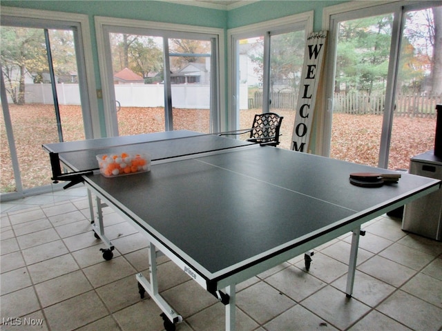 game room featuring light tile patterned flooring and a wealth of natural light