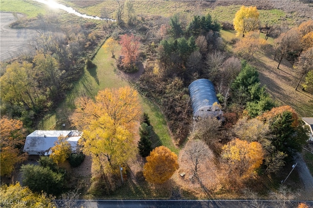 birds eye view of property with a rural view