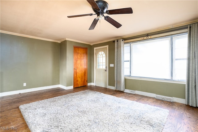 foyer featuring ornamental molding, hardwood / wood-style floors, and ceiling fan