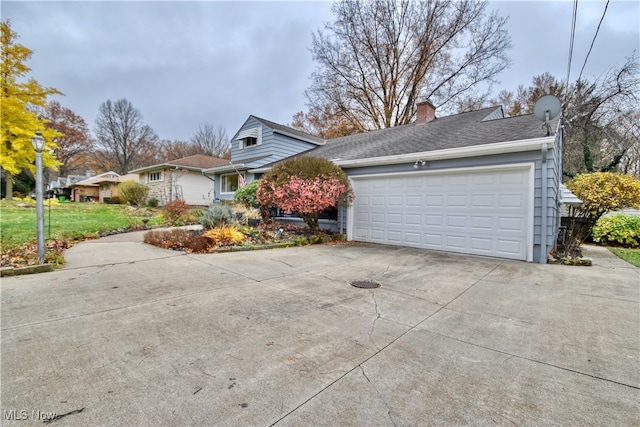 view of property exterior with a garage