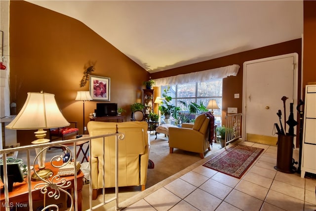 living room with lofted ceiling and light tile patterned floors