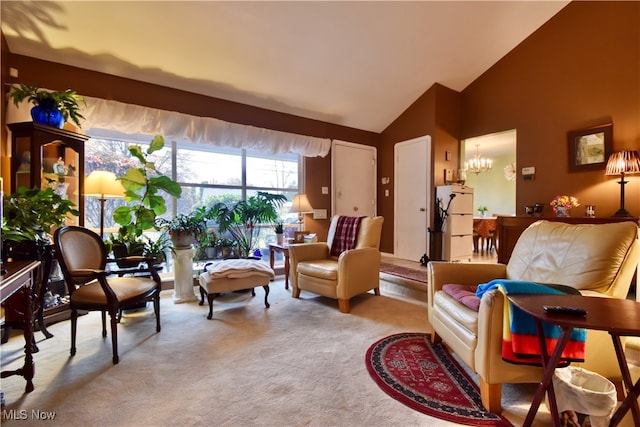 living room featuring high vaulted ceiling, light colored carpet, and an inviting chandelier