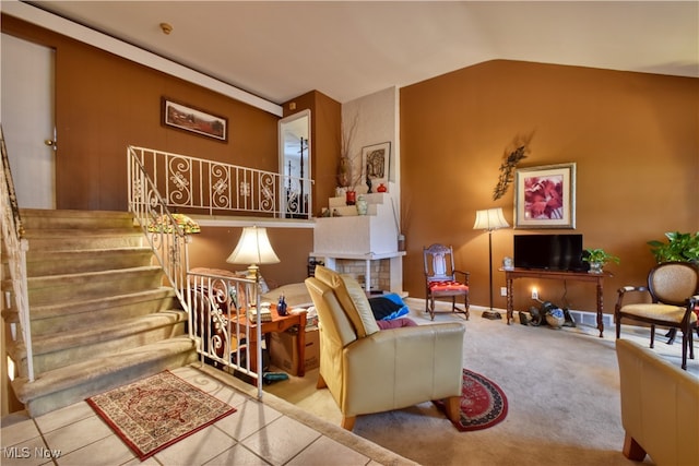 carpeted living room featuring lofted ceiling