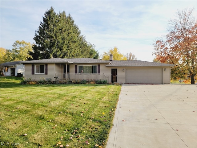 single story home featuring a front yard, covered porch, and a garage