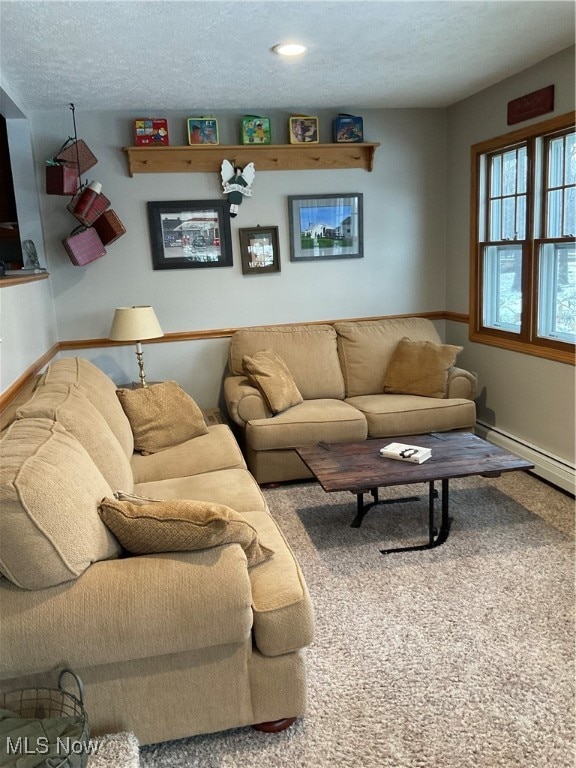 living room featuring carpet floors and a textured ceiling