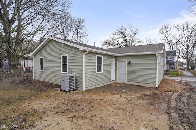 rear view of house with central AC