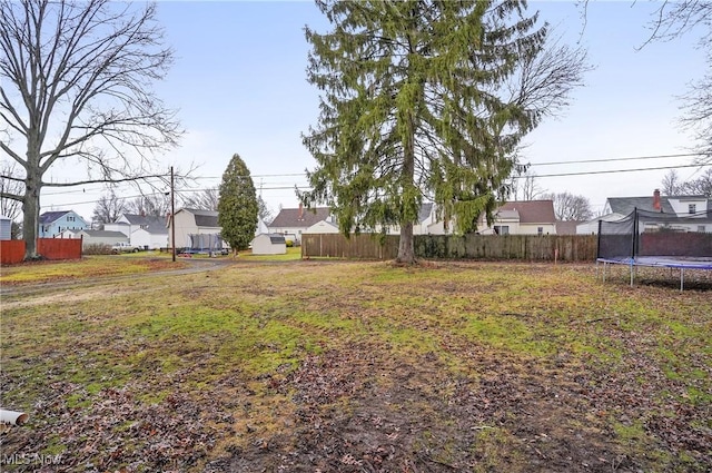 view of yard featuring a trampoline