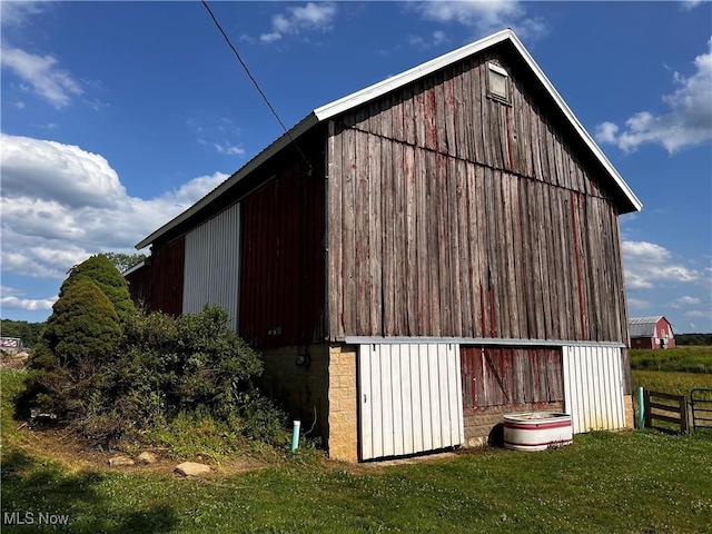 view of outbuilding with a yard