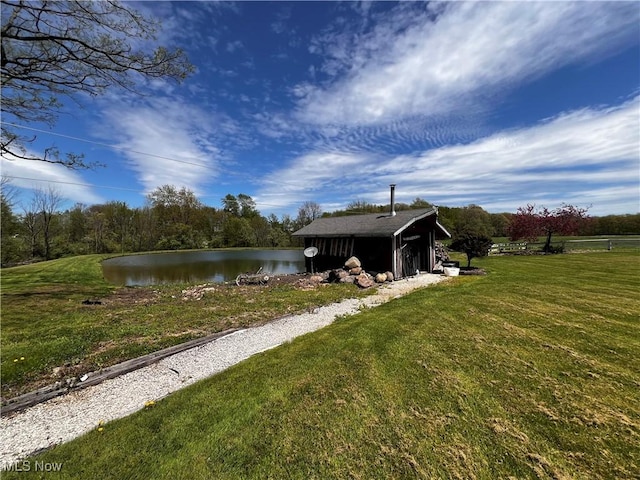 dock area featuring a water view and a yard