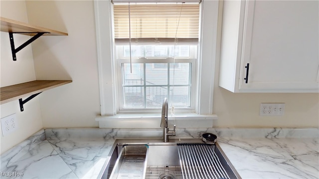 details featuring sink and white cabinets