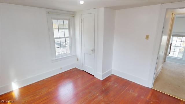 spare room featuring dark wood-type flooring