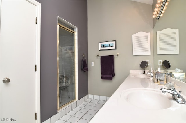 bathroom featuring a shower with door, tile patterned flooring, and vanity