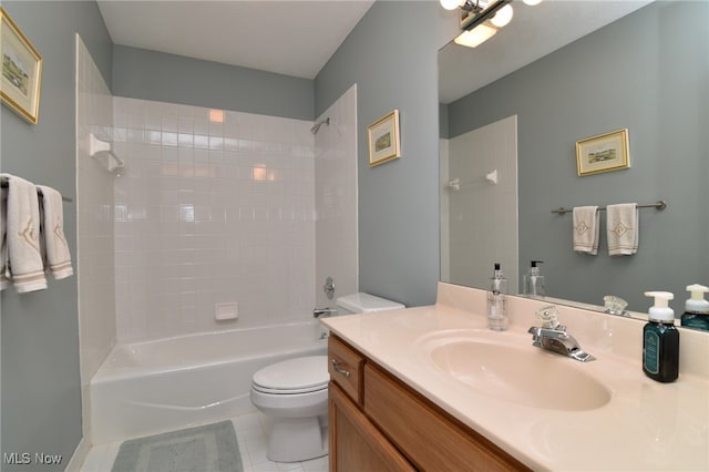 full bathroom with toilet, tiled shower / bath, vanity, and tile patterned flooring