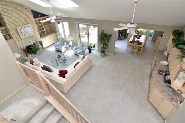 432 Chipping Ln, Chagrin Falls, OH 44023 - living area featuring lofted ceiling, carpet, a ceiling fan, and plenty of natural light