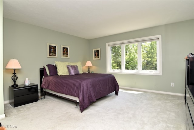 bedroom with light colored carpet