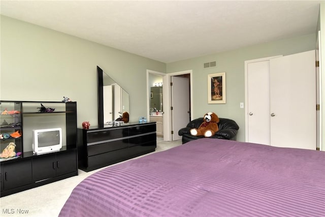 432 Chipping Ln, Chagrin Falls, OH 44023 - bedroom with light colored carpet, ensuite bathroom, and visible vents