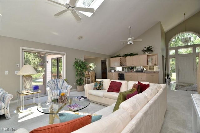 432 Chipping Ln, Chagrin Falls, OH 44023 - living area featuring light carpet, a healthy amount of sunlight, ceiling fan, and high vaulted ceiling
