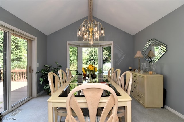 dining space featuring lofted ceiling with beams, a notable chandelier, and light colored carpet