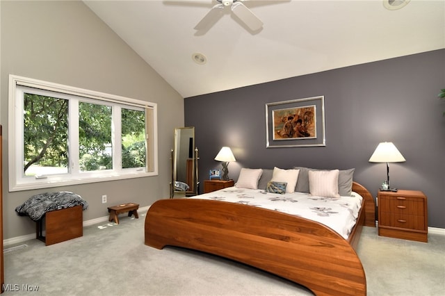 bedroom featuring ceiling fan, high vaulted ceiling, and light colored carpet