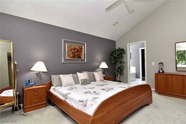 carpeted bedroom featuring ensuite bathroom, high vaulted ceiling, and ceiling fan