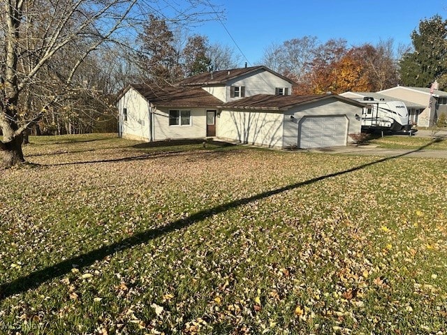 view of property exterior with a yard and a garage