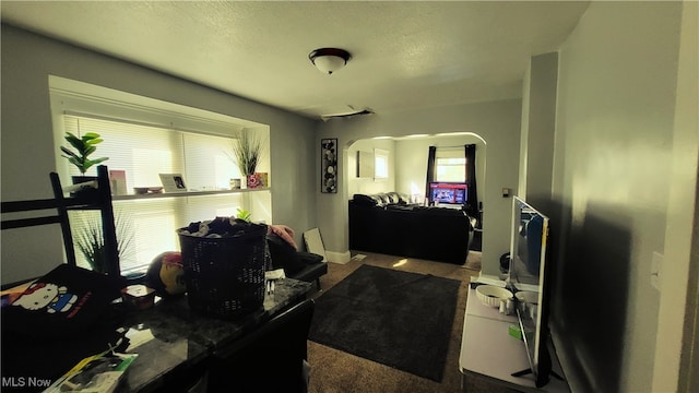 interior space with a textured ceiling