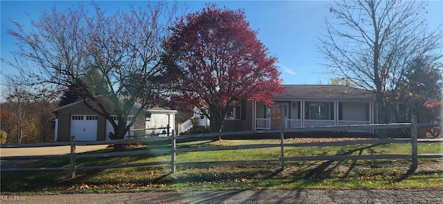 ranch-style house with a front lawn and a garage