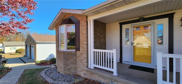 view of exterior entry with a porch