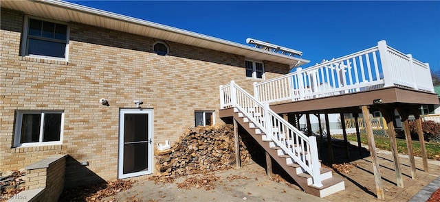 view of exterior entry with a deck