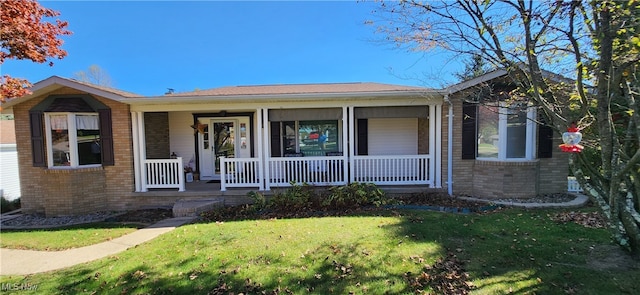 view of front of home featuring a front yard and a porch