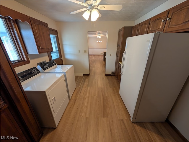 kitchen featuring washer and clothes dryer, white refrigerator, a textured ceiling, light hardwood / wood-style floors, and ceiling fan