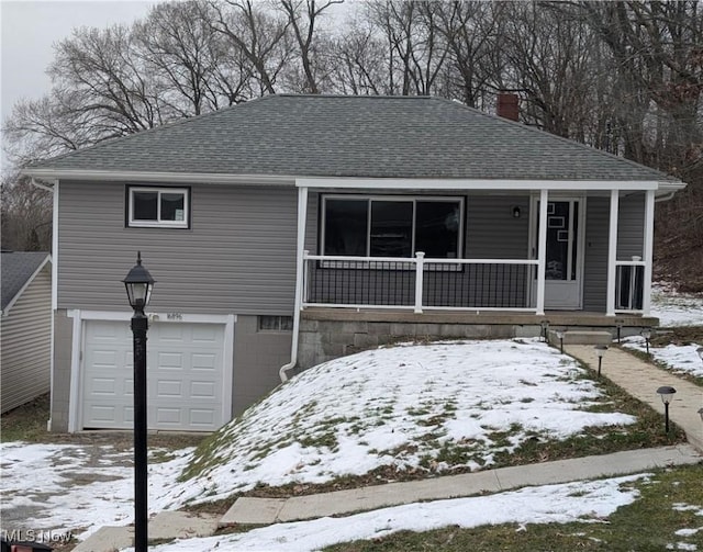 view of front facade with a garage and covered porch