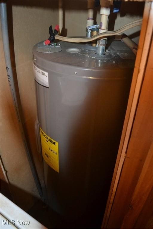 utility room featuring electric water heater