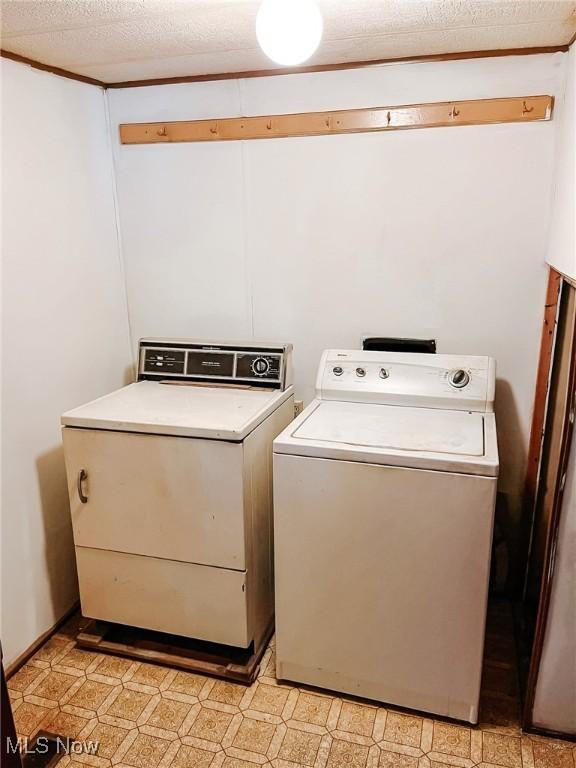 laundry room with washing machine and clothes dryer