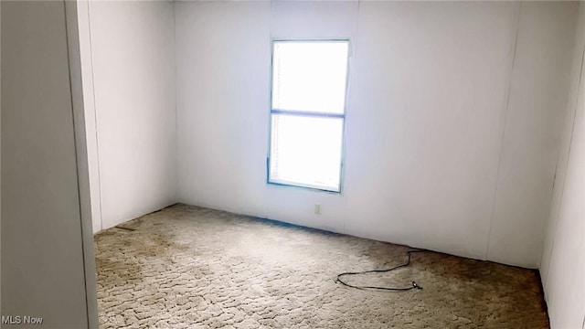 spare room with carpet flooring