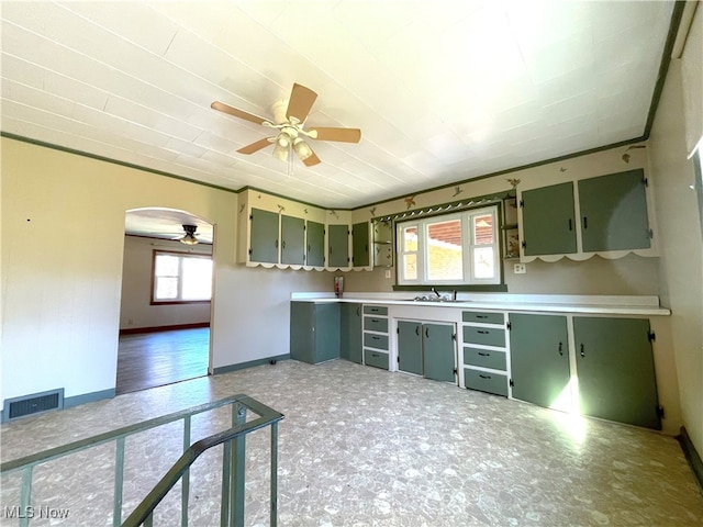 kitchen with sink, ceiling fan, and a wealth of natural light