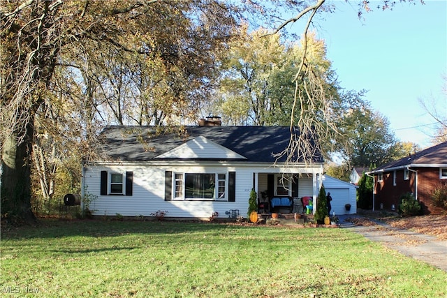 view of front of house with a front lawn and a garage