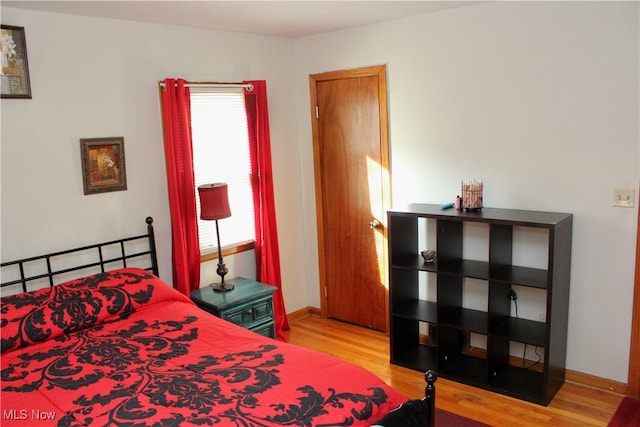 bedroom with light wood-type flooring