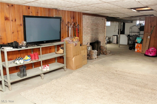 basement featuring wood walls