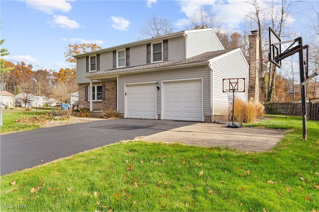 view of front of house with a garage and a front yard