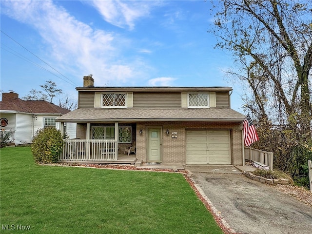 view of front facade featuring covered porch, a garage, and a front lawn