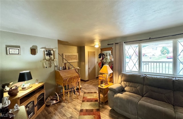 living room featuring hardwood / wood-style flooring and a textured ceiling